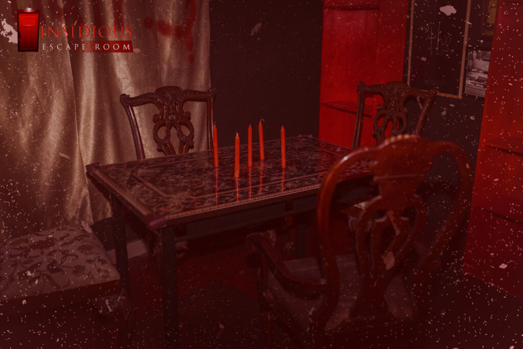 Blood-red dining room set inside the best horror escape room in Dubai