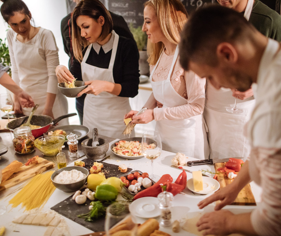Colleagues at a cooking class, one of the indoor team building activities in Dubai