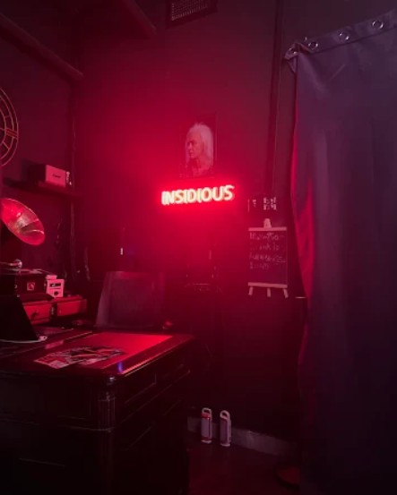 Neon-lit room inside Insidious, the best escape room in Dubai for atmosphere