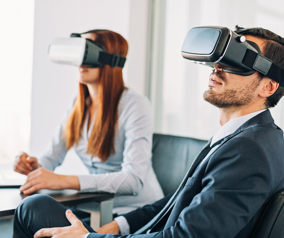 Two colleagues in VR headsets during a virtual reality team building game